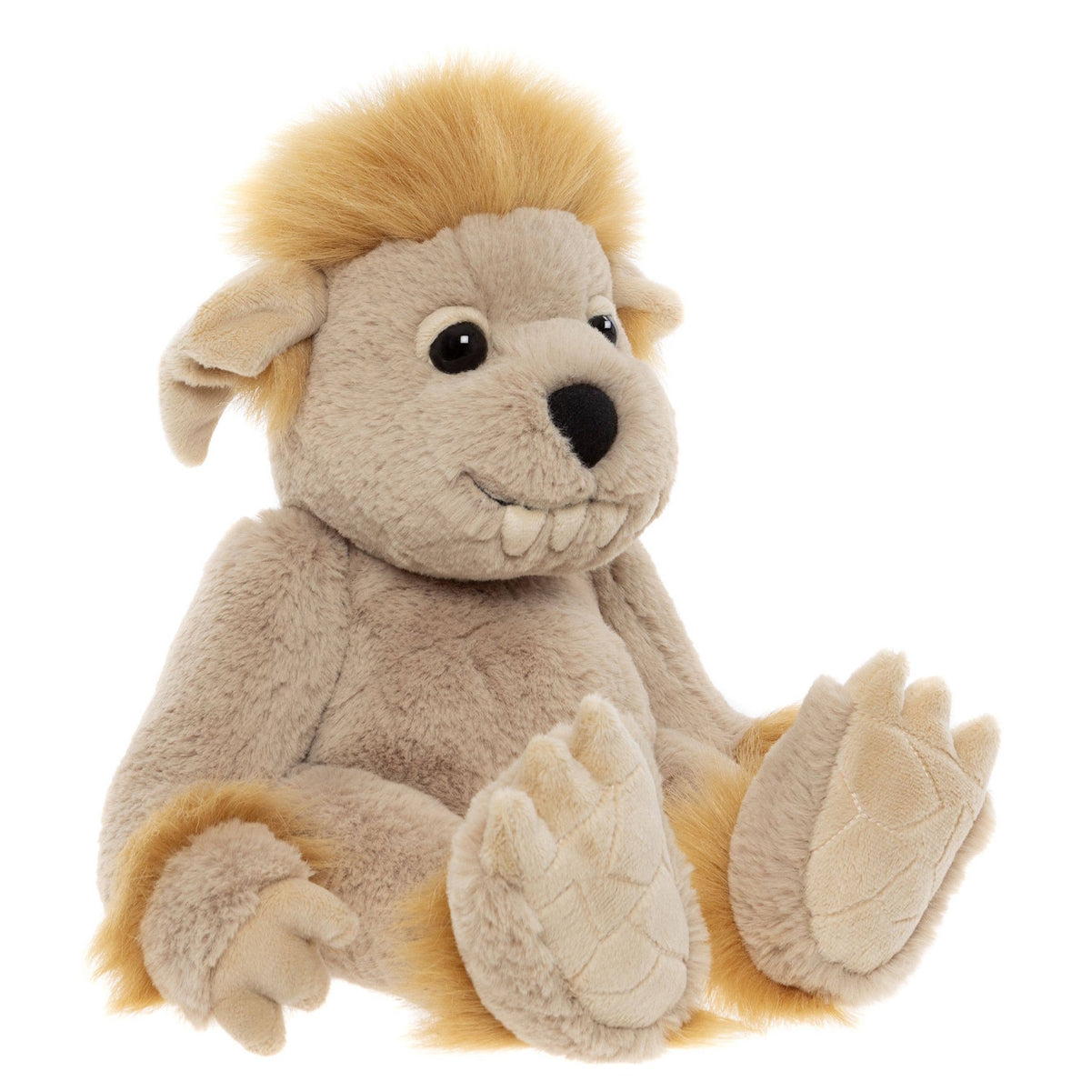 A plush creature toy sitting down, featuring beige fur, fluffy yellow hair, floppy ears, and prominent teeth.
