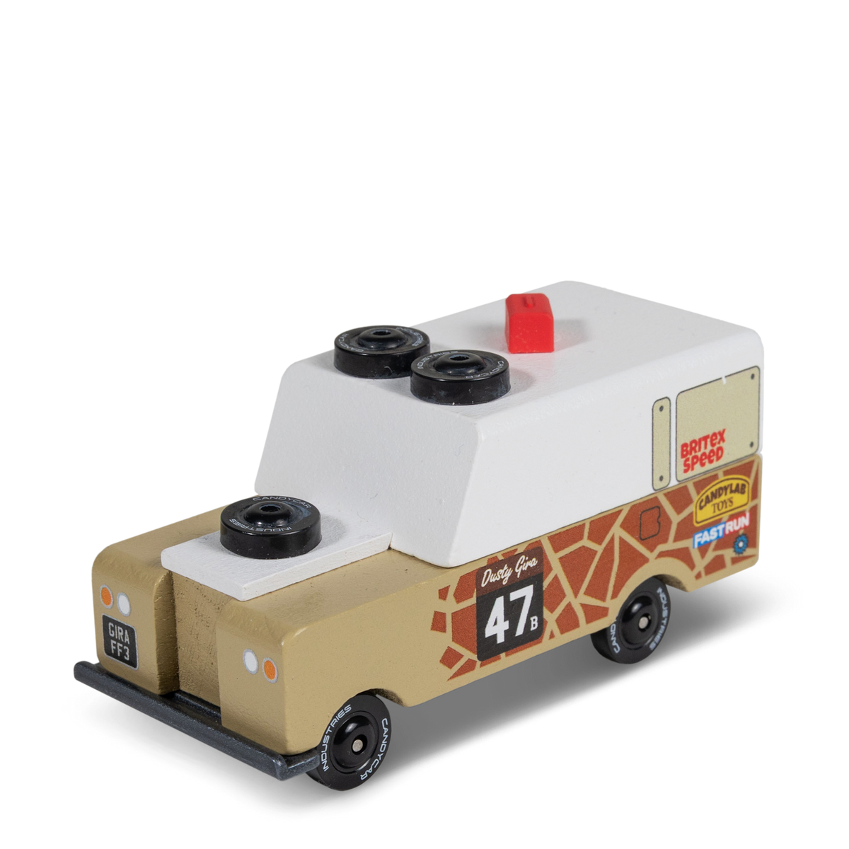 Candycar Gira Drifter wooden toy truck with giraffe print, white camper top, and spare tires on a white background.