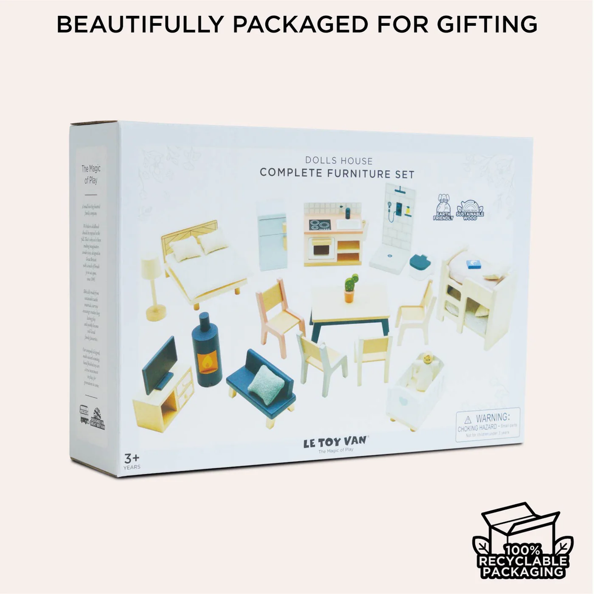 Box of a dolls' house furniture set, showing miniature pieces like a bed, chairs, and appliances. Features "beautifully packaged for gifting" and "100% recyclable packaging" text.