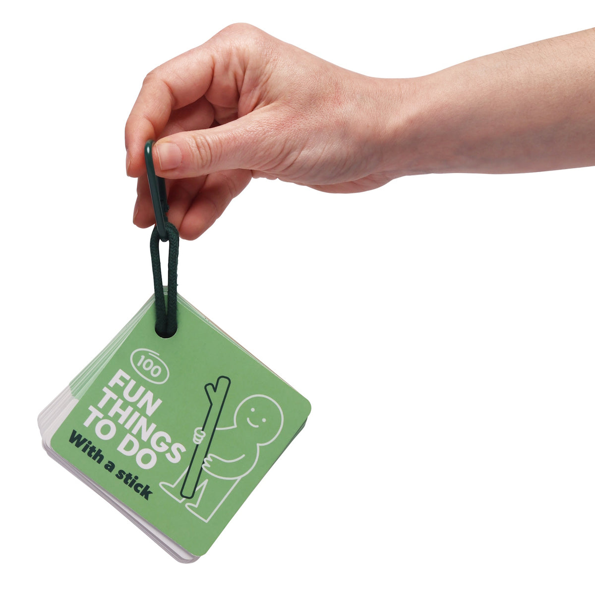 A hand holding a green card deck titled "100 Fun Things To Do With a stick" on a dark green loop clip.