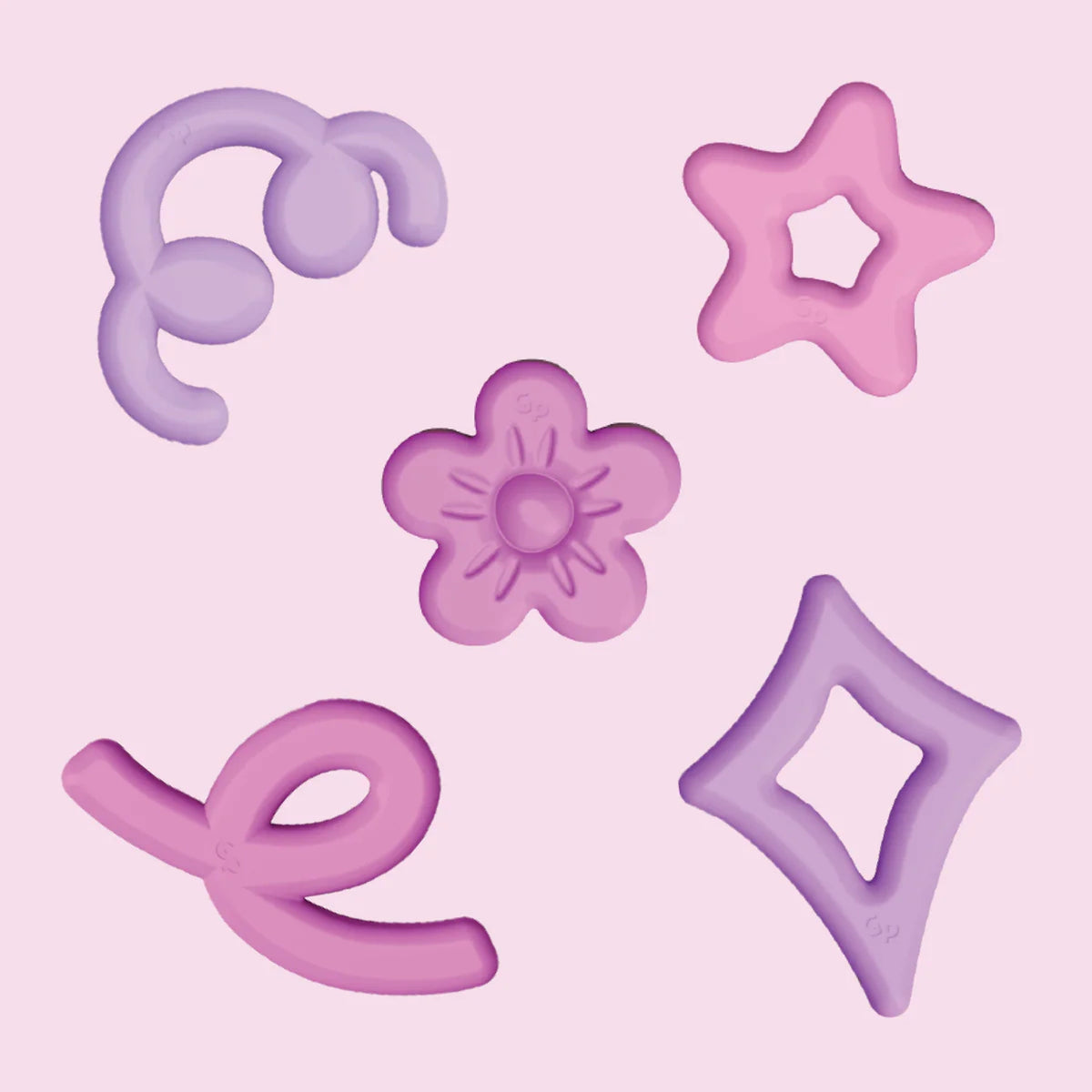 Pink and purple sensory shapes including a flower, star, diamond, and swirls on a soft pink background.