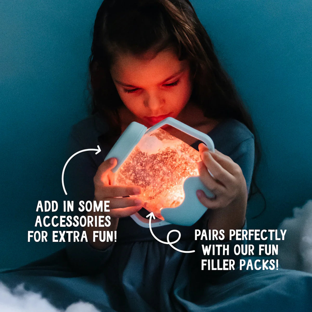 Child holding a glowing Glo Pals sensory play jar filled with water and accessories in the dark.