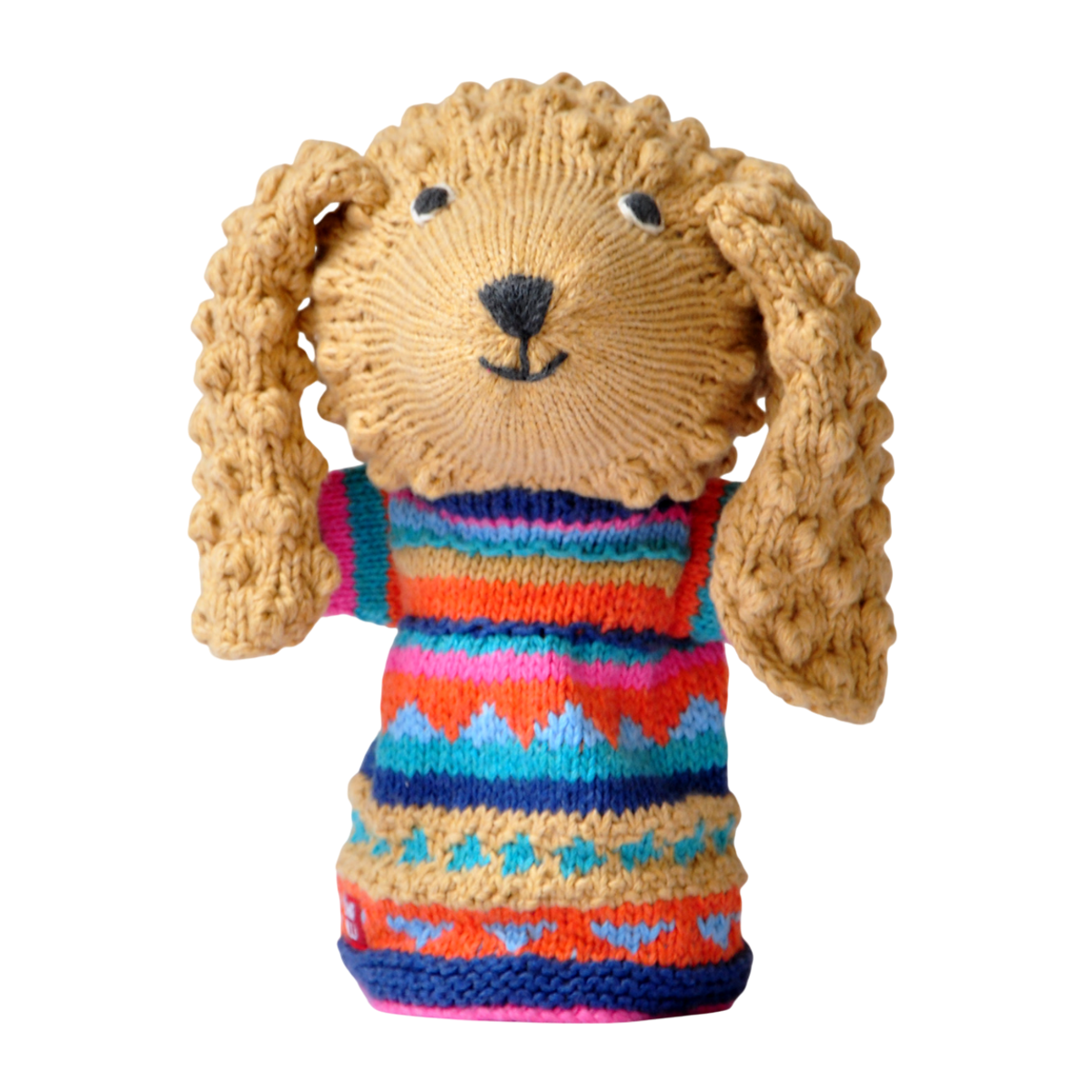 Knitted dog puppet with curly ears, wears a colorful sweater with geometric patterns in orange, blue, pink, and teal, set against a white background.