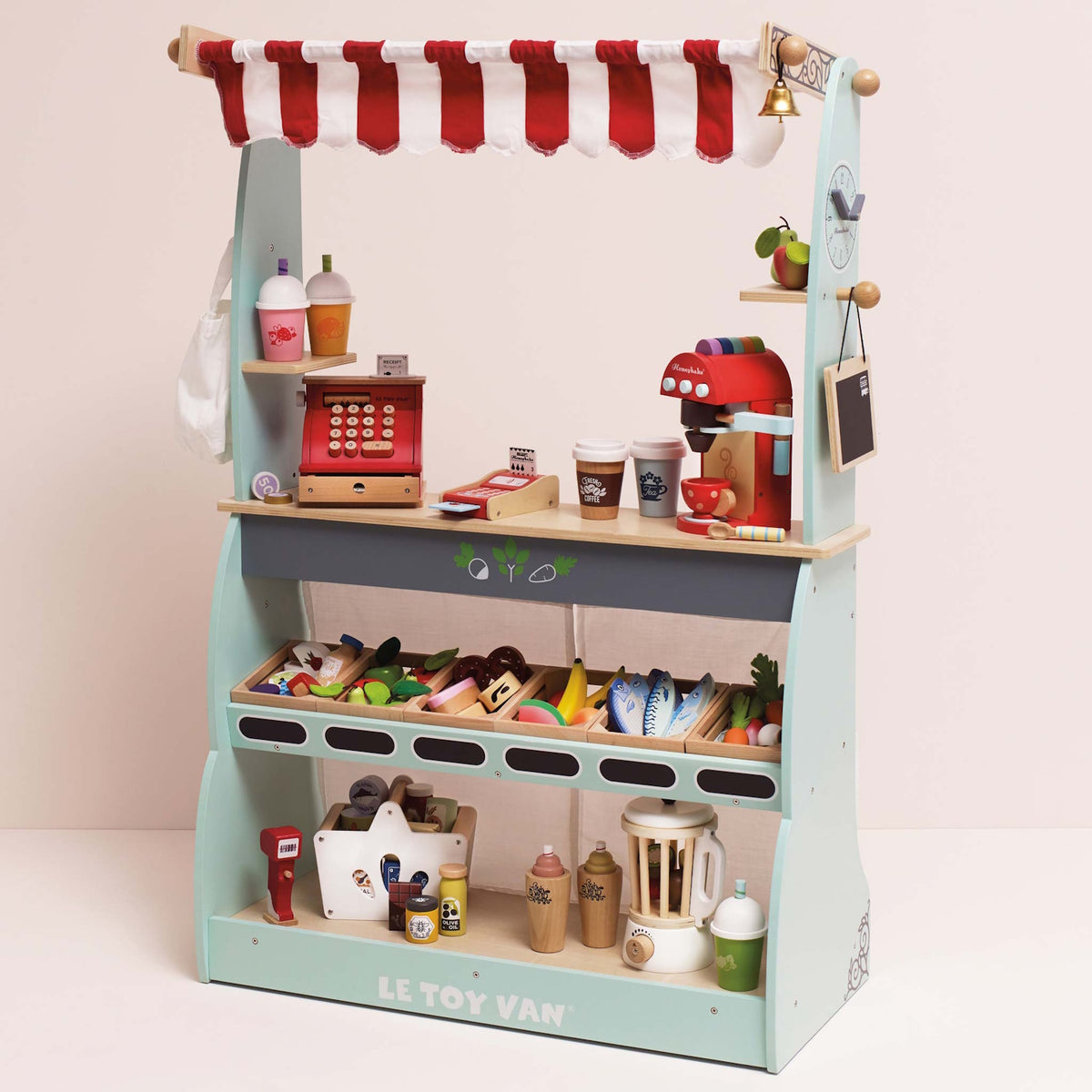 Wooden market stall play set with a red-striped awning, toy cash register, coffee machine, and food.