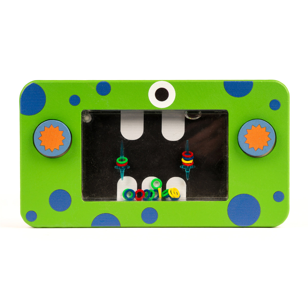 Bright green rectangular toy with blue polka dots and two gear-shaped knobs, featuring a black screen with colorful rings and a whimsical eye design.