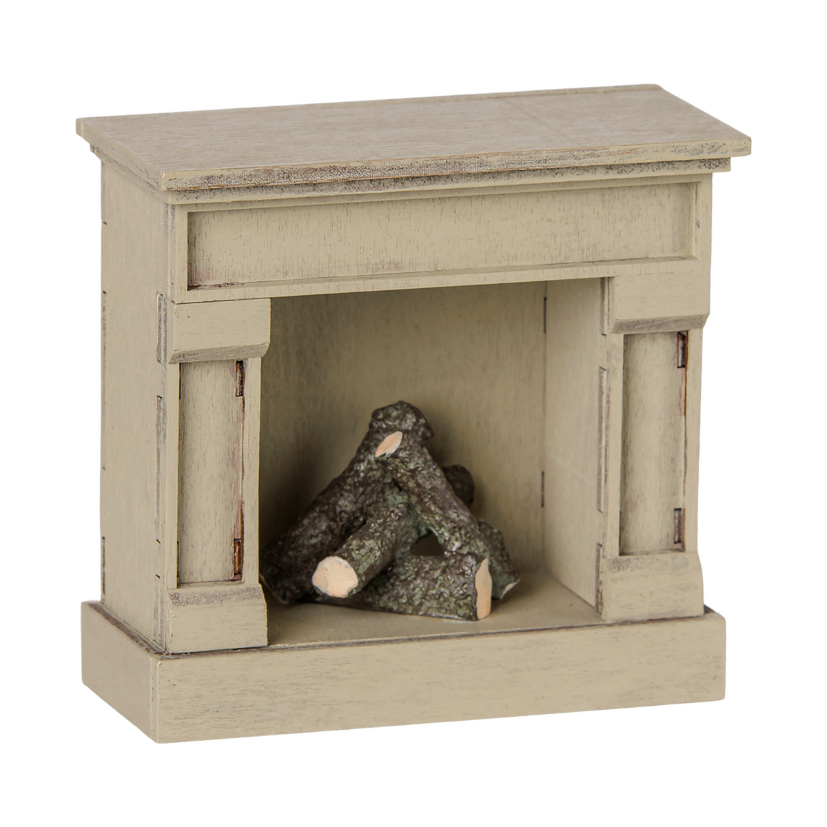 An off-white miniature vintage fireplace with faux logs inside, set against a solid white background.