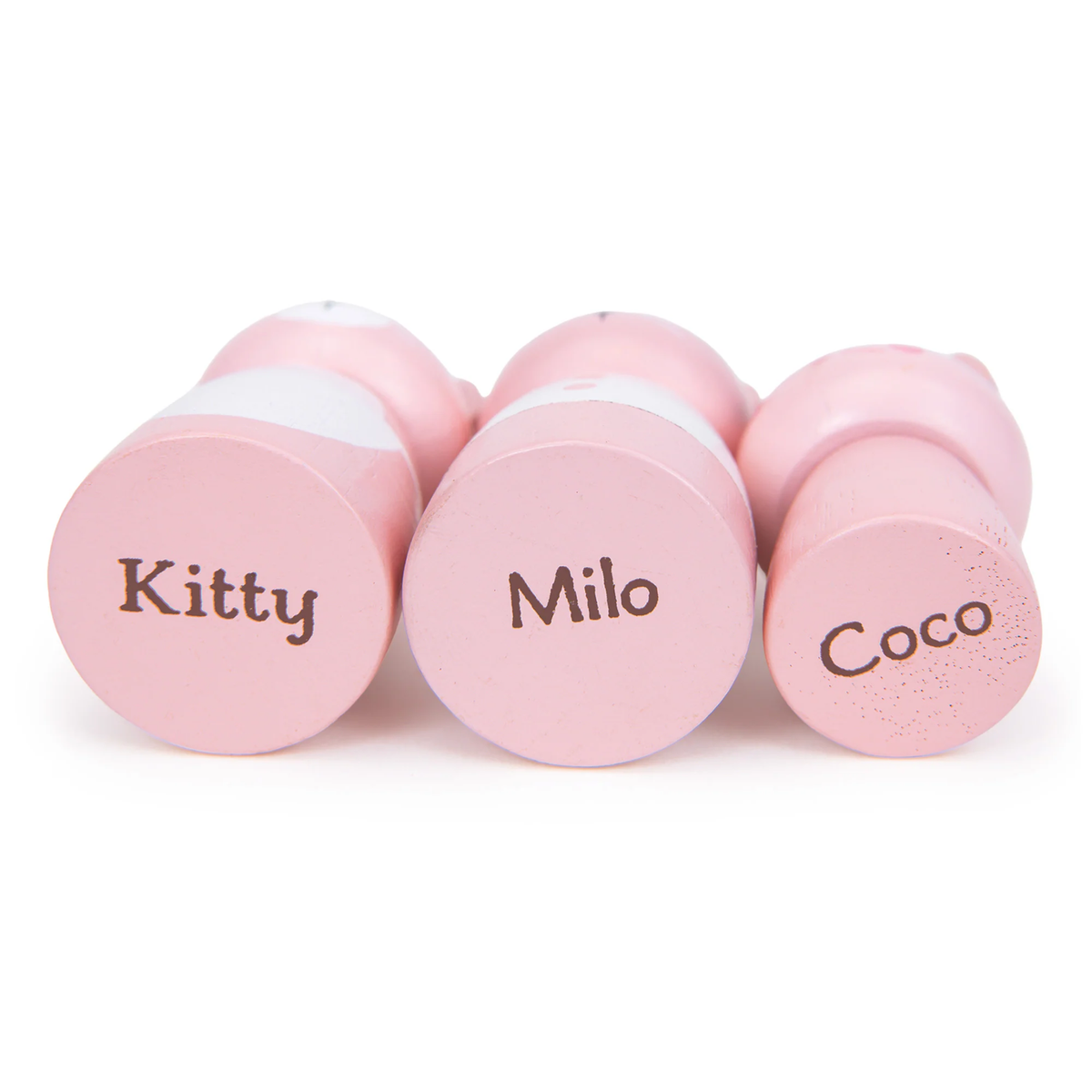 Bottoms of three pink toy cat figures printed with the names Kitty, Milo, and Coco.