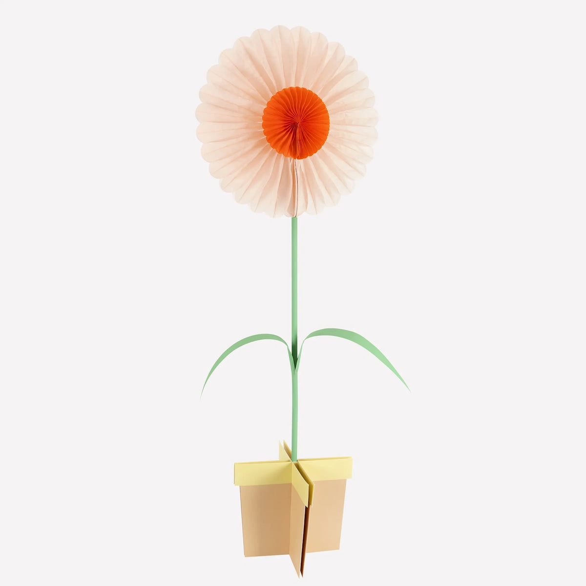 A stand-up paper flower decoration with peach petals, an orange center, and a yellow base stand.