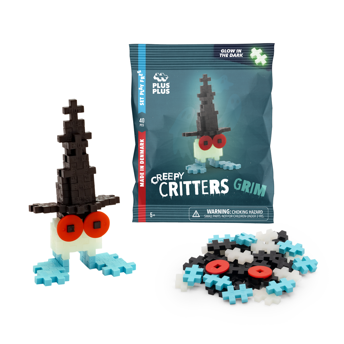 Building toy set named "Creepy Critters Grim" with glow-in-the-dark feature. Includes black, white, and blue pieces, plus red eyes. Fun and playful.
