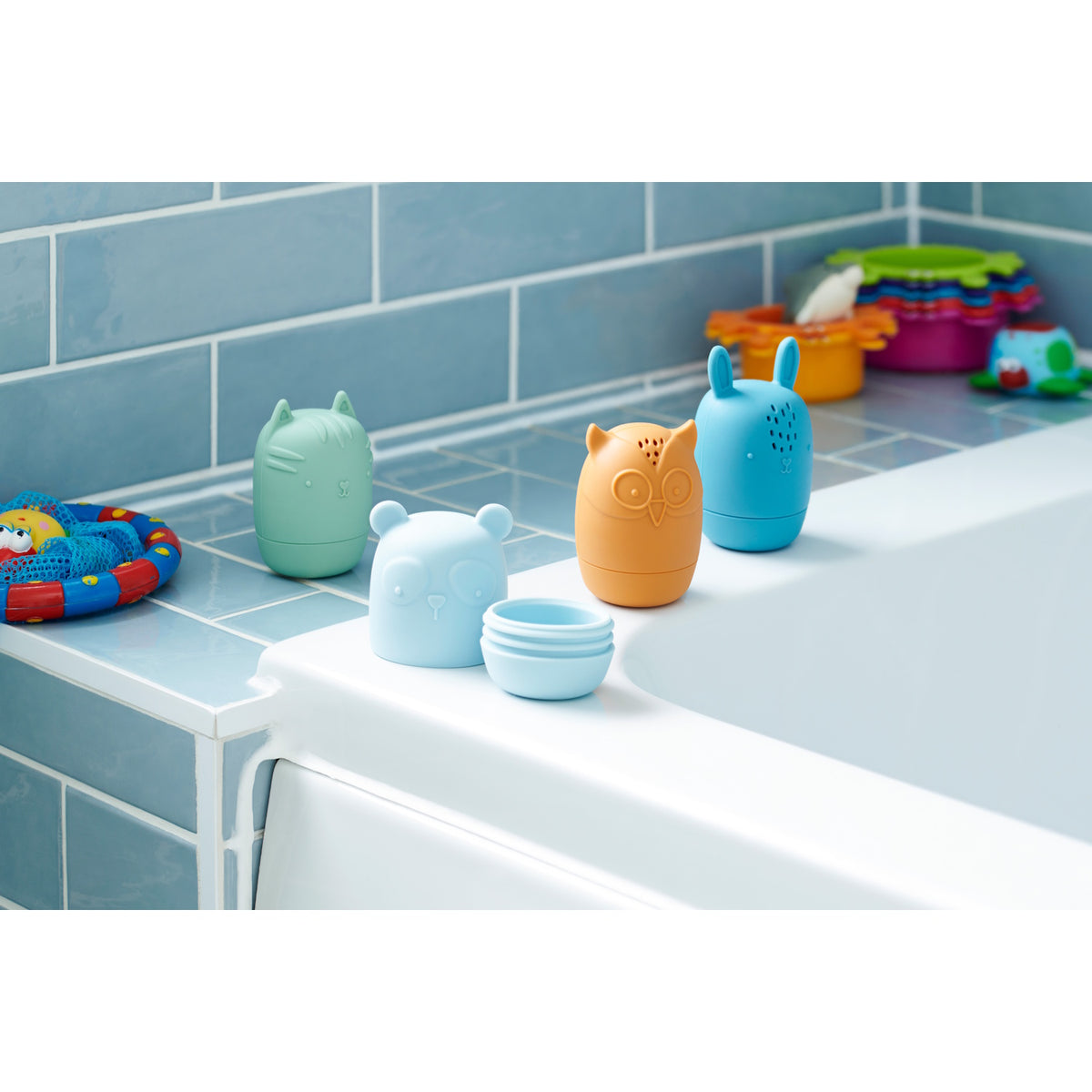 A set of soft silicone animal-shaped squirters in neutral tones, designed for sensory play and water-based fun, perfect for young children.