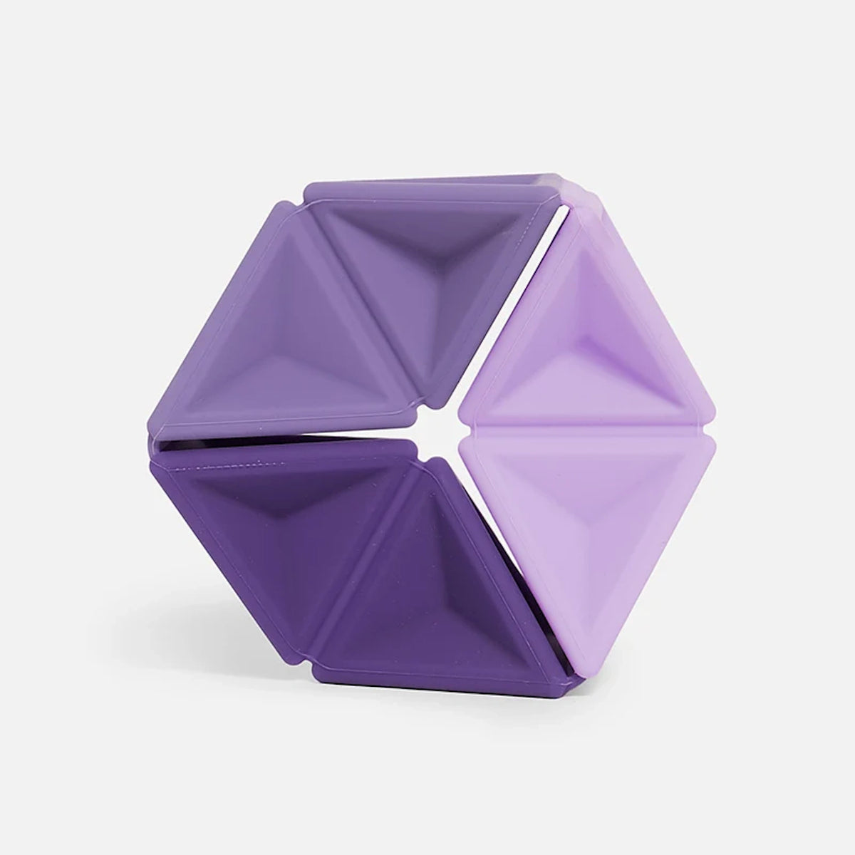 Hexagonal silicone fidget toy featuring triangular segments in three shades of purple.