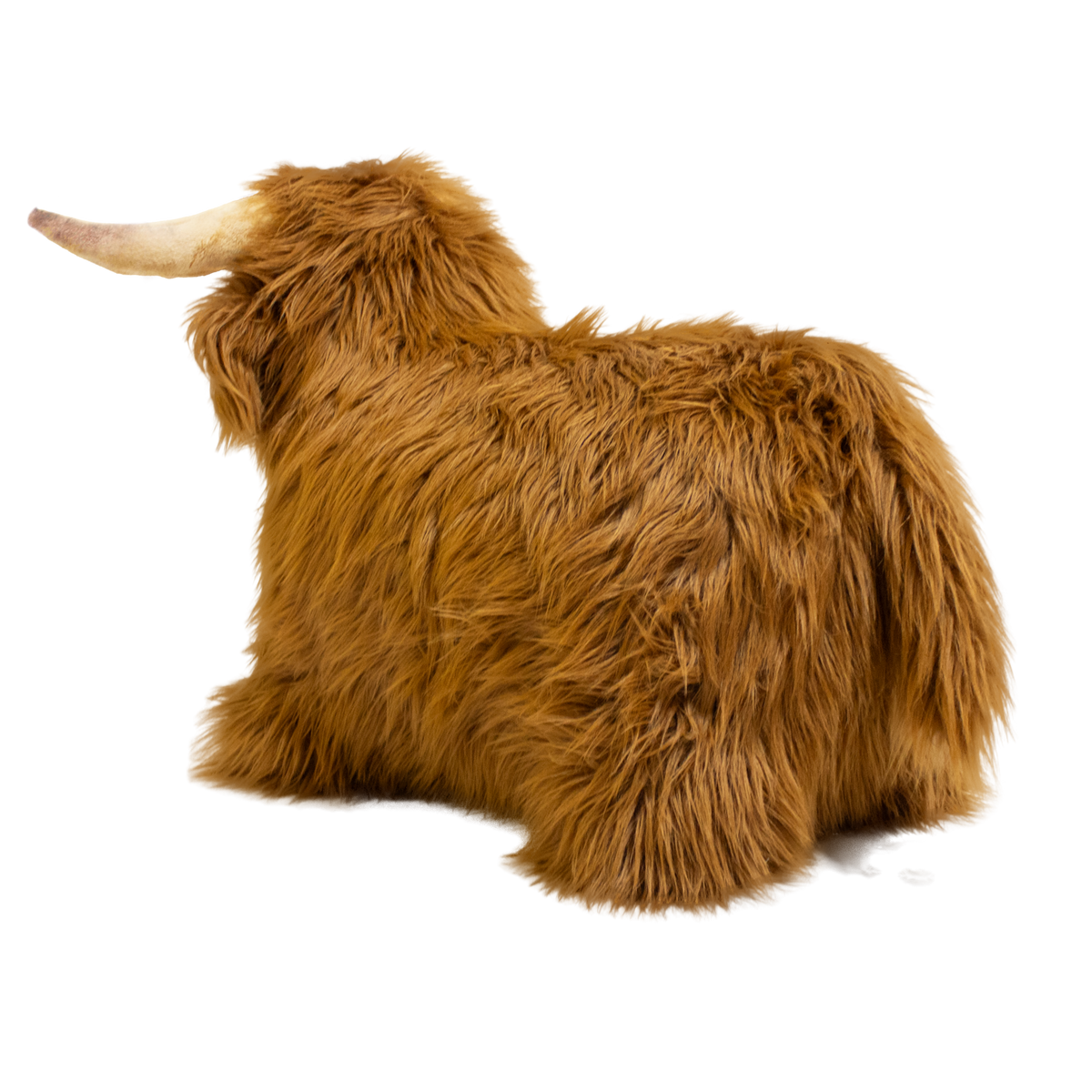 Fluffy brown plush toy resembling a Highland cow, with long fur and curved horns, set against a white background, conveying a cozy and whimsical feel.