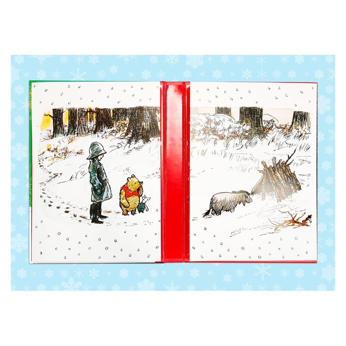 Flat lay view of open Winnie-the-Pooh Advent Calendar book showing illustrated winter scenes inside.