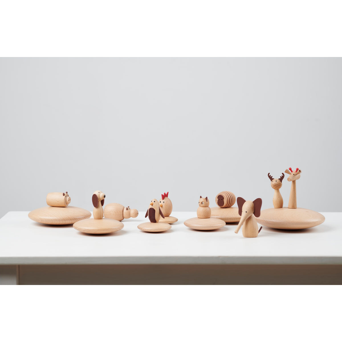 A set of charming, painted wooden animal figures designed for imaginative play, storytelling, and early learning activities.