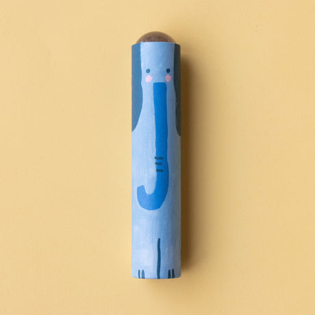 A close-up of a blue elephant-themed kaleidoscope with a friendly illustrated design on a yellow background.