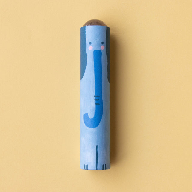 A close-up of a blue elephant-themed kaleidoscope with a friendly illustrated design on a yellow background.