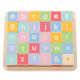 Colorful wooden alphabet blocks arranged in a grid inside a wooden tray.