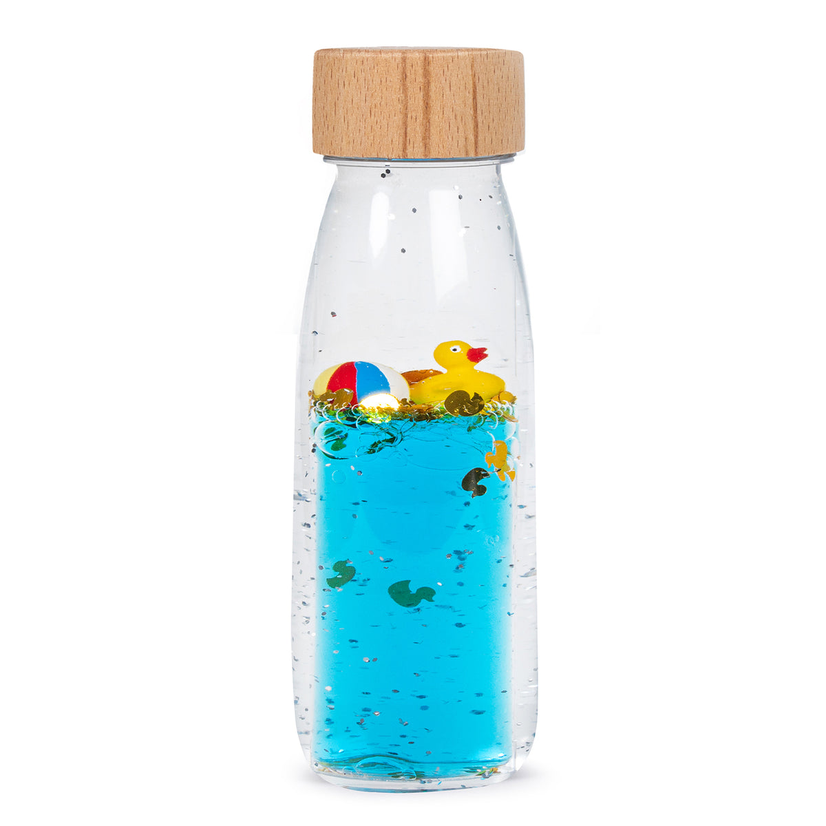 A clear sensory bottle with blue liquid, containing a floating rubber duck, beach ball, and decorative glitter.