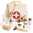 Wooden toy animal vet kit with a canvas medical bag, stethoscope, syringe, brush, and accessories.