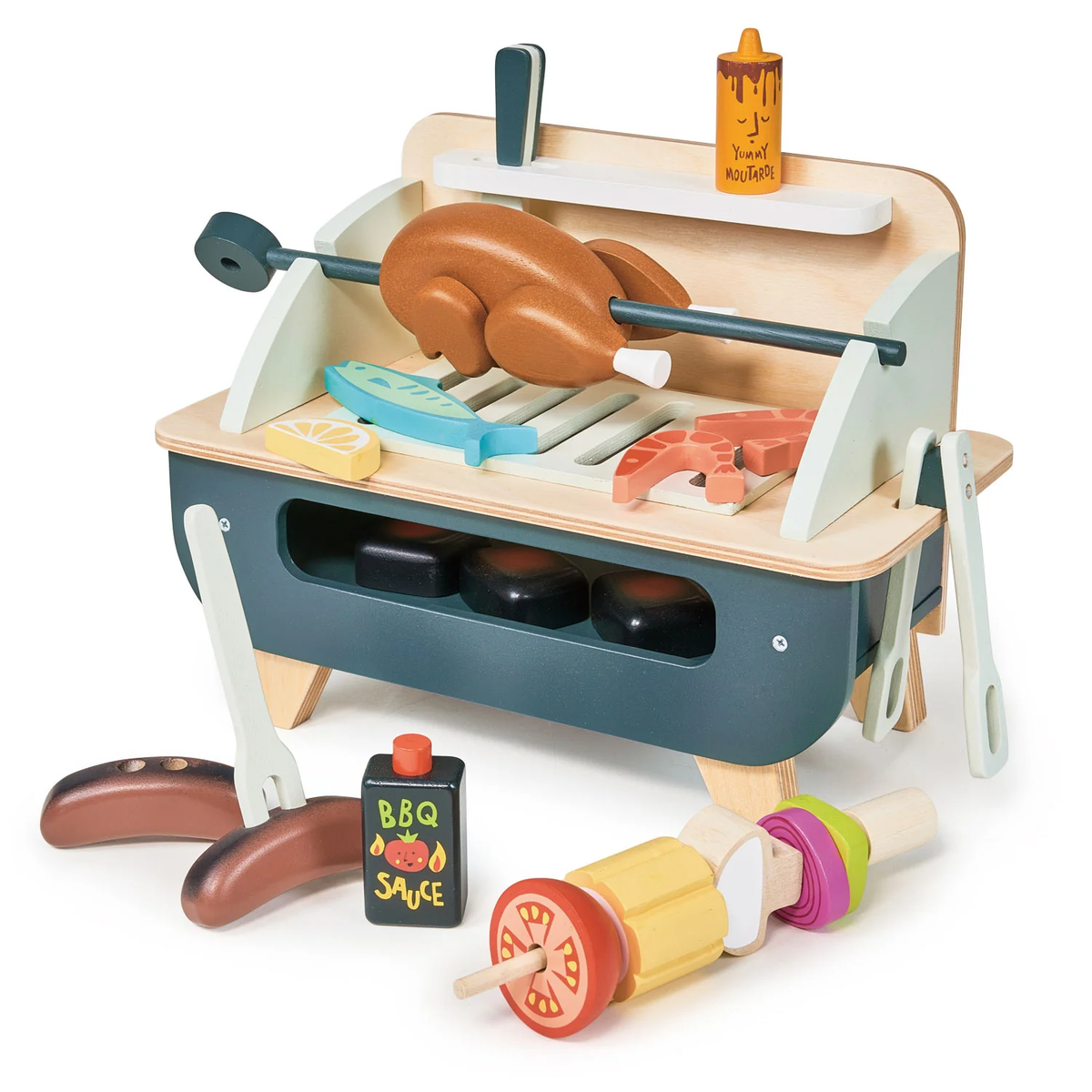 Wooden toy barbecue set featuring a rotisserie chicken, skewers, sausages, and sauce bottles.