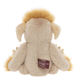 Back view of a seated beige plush creature toy featuring fluffy yellow hair, floppy ears, and a fabric tag.