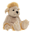 A plush creature toy sitting down, featuring beige fur, fluffy yellow hair, floppy ears, and prominent teeth.