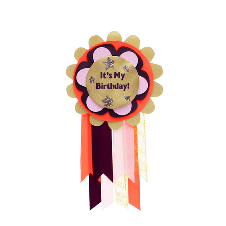 "It's My Birthday!" rosette badge with colorful layered scalloped trim and hanging ribbons.