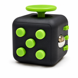 Front view of the black plastic multi-sensory fidget cube with green buttons and a metal rolling ball.