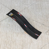 Black Candylab Roadworks Hop Expansion Pack wooden toy ramp with "Don't Slow Down" text on a white textured rug.