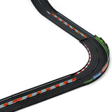 Close-up of Candylab Roadworks straight and curved black toy race track with orange barriers and colorful signage.