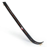Candylab Roadworks Super Speed playset with a wooden toy car racing down a long, curved black track with orange barriers.