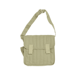 Sage green quilted convertible diaper changing messenger bag with adjustable shoulder strap.
