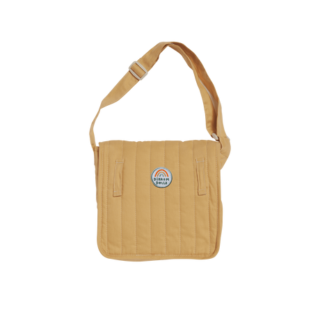 Honey yellow quilted doll changing bag with an adjustable shoulder strap and rainbow logo.