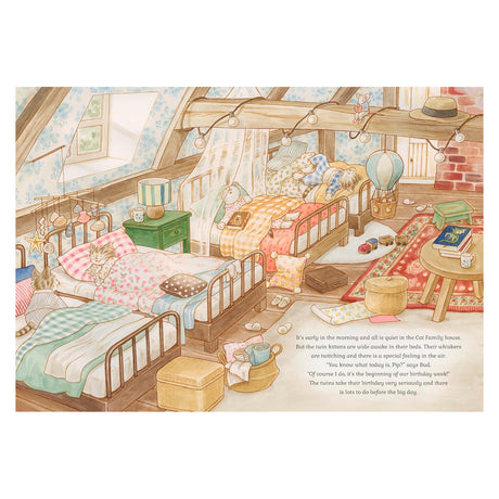 Illustrated children's book page showing an attic bedroom with twin kittens waking up in their beds.