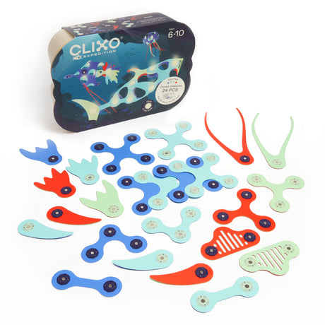 A Clixo Ocean Creatures Glow Pack box sitting next to a spread of 24 colorful, magnetic toy pieces.