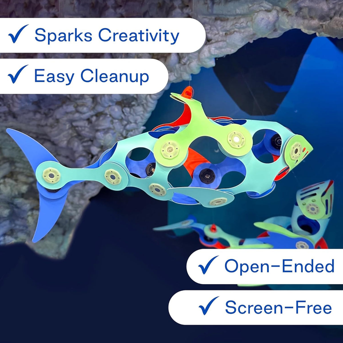 Colorful magnetic fish toy model floating with text callouts: Sparks Creativity, Easy Cleanup, Open-Ended, Screen-Free.