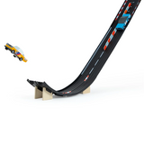 Close-up of Candylab Roadworks Speed Playset with a yellow wooden car jumping off a black toy racing ramp.