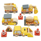 Set of yellow wooden toy construction vehicles, traffic cones, and a road sign.
