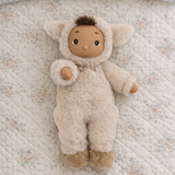 Olli Ella Cozy Dinkum Lamby plush doll on a floral quilted blanket.