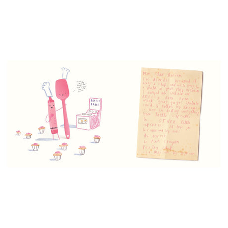 A pink crayon and spatula in chef hats stand by cupcakes and a toy oven beside a handwritten letter.