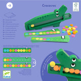 Djeco Crococroc wooden crocodile toy with colorful discs for logical color sequence learning games.