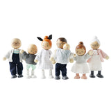 A set of seven wooden dollhouse family figures lined up standing against a white background.