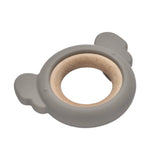 Grey silicone and wooden baby teething ring shown at an angle.