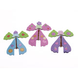 Three colorful paper flying fairies with rubber band mechanisms lined up on a white background.