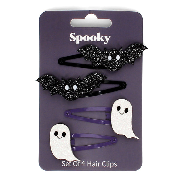Set of four Halloween hair clips featuring two black glitter bats and two white glitter ghosts on a card.