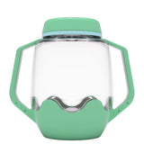 Clear plastic sensory jar with teal green handles, lid, and base against a plain white background.