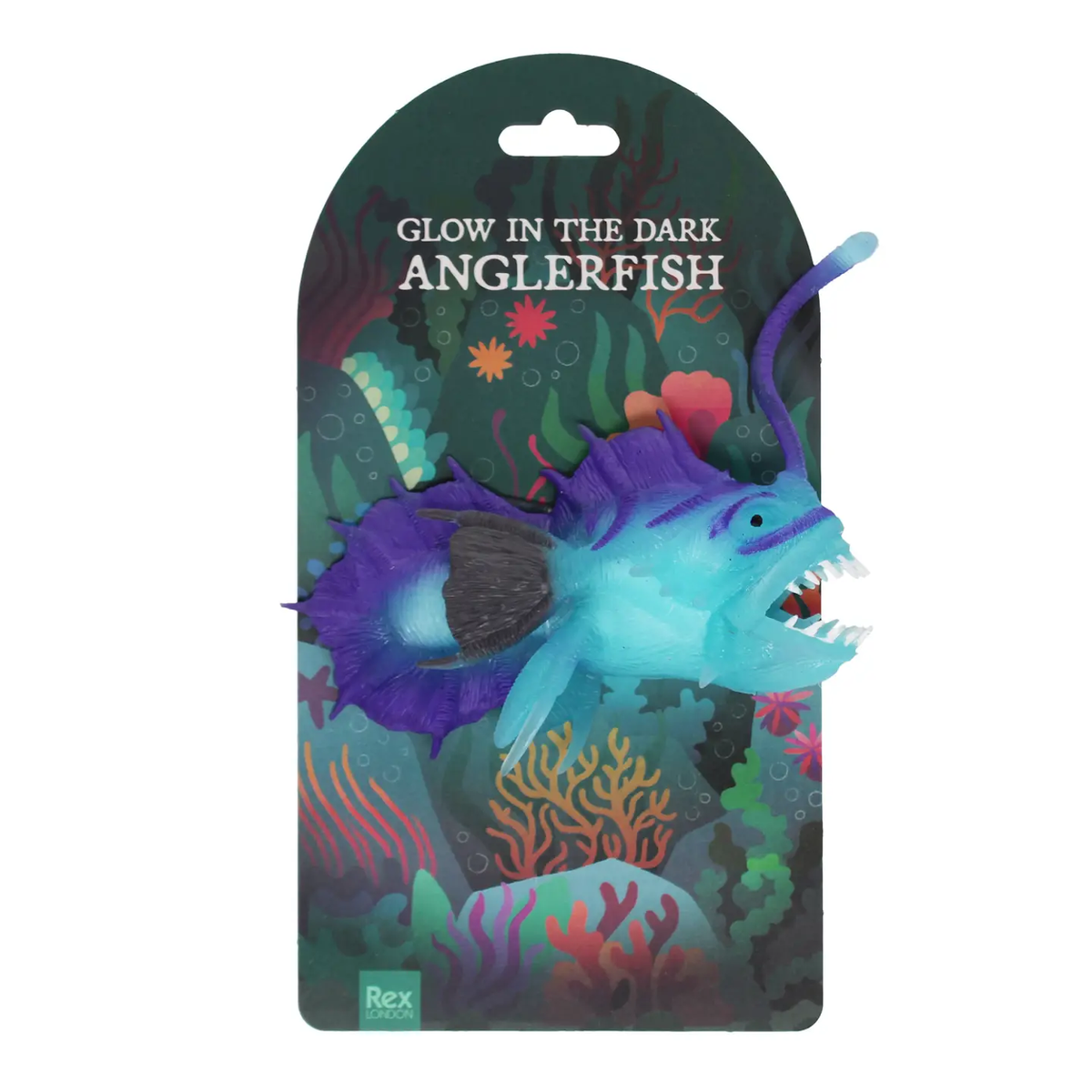 Glow-in-the-dark anglerfish toy in blue and purple on colorful ocean-themed packaging. Text reads: "Glow in the Dark Anglerfish."