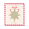 Meri Meri gold glitter star decoration package with a pink bow and red checkered border.