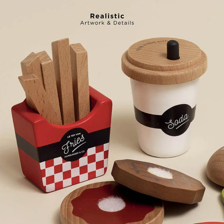 Wooden toy fries in a red holder and a soda cup alongside burger ingredients with realistic artwork.