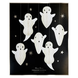 Meri Meri hanging ghost decorations packaging set containing 6 white paper honeycomb ghosts against a star-patterned black backdrop.